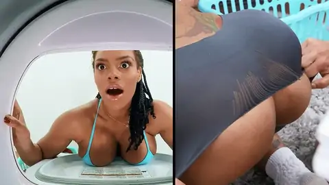 A big-chested ebony gets stuck in the washing machine