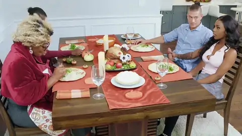 Tattooed ebony super-bitch is riding a BWC by the table