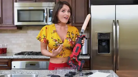 Prepping to penetrate the dark-haired babe with a machine