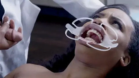 Medic nails face of astonished patient in the polyclinic